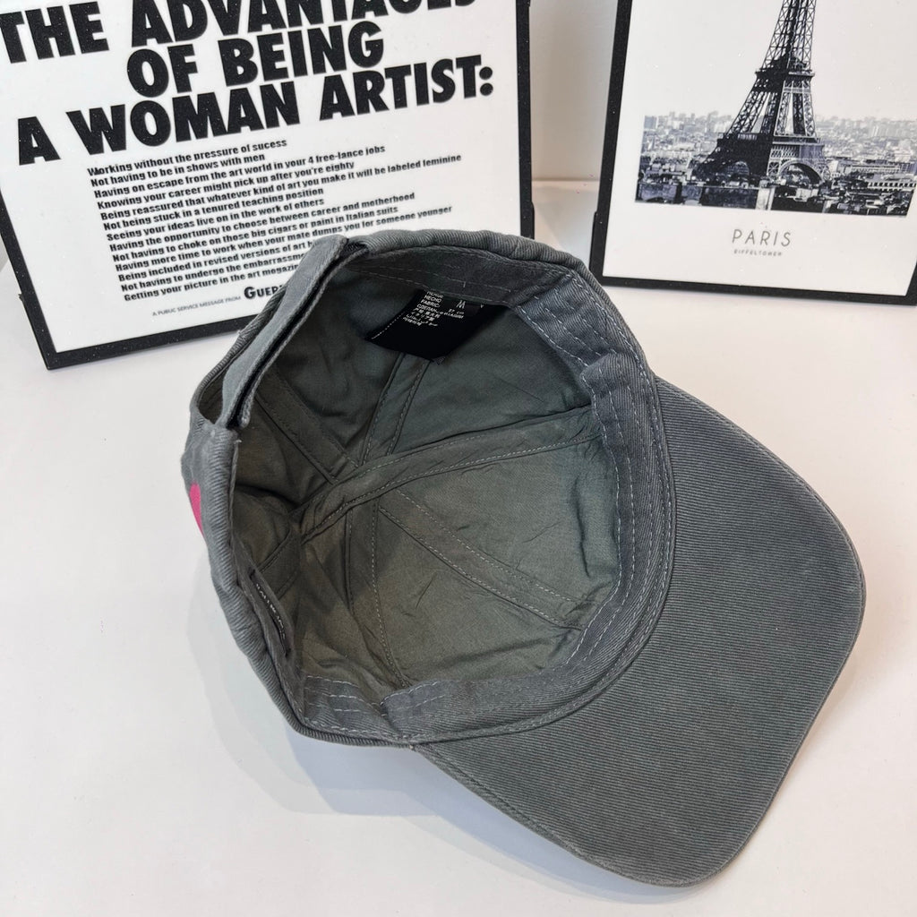 Baseball cap interior view, dark gray fabric lining and small label at top.
