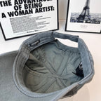 Balenciaga dark gray cap interior view with curved brim and woven label