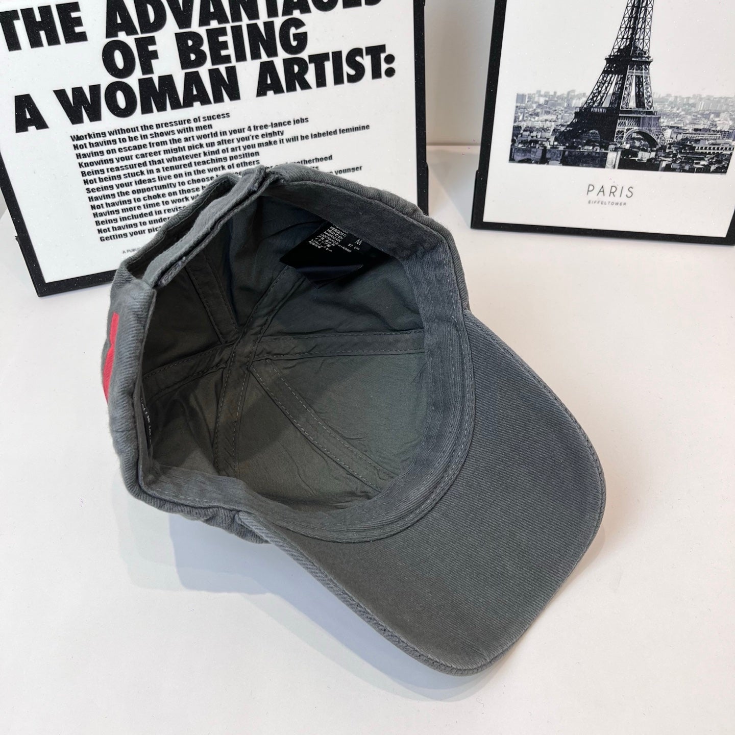 Gray baseball cap interior with inner seams and curved brim