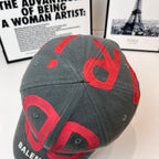 Balenciaga dark gray cap with red B logo and curved brim red lettering