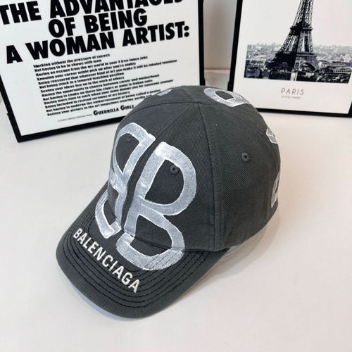 Dark gray baseball cap with oversized silver 'B' logo and BALENCIAGA text