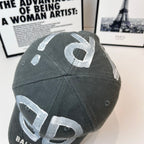 Dark gray baseball cap with silver 'B' on side panel