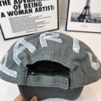Dark gray baseball cap interior with stitched brim edge and crown lining