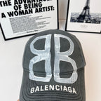 Dark gray baseball cap with large silver 'B' and BALENCIAGA lettering at front