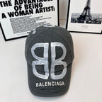 Dark gray baseball cap with large silver 'B' and BALENCIAGA logo front