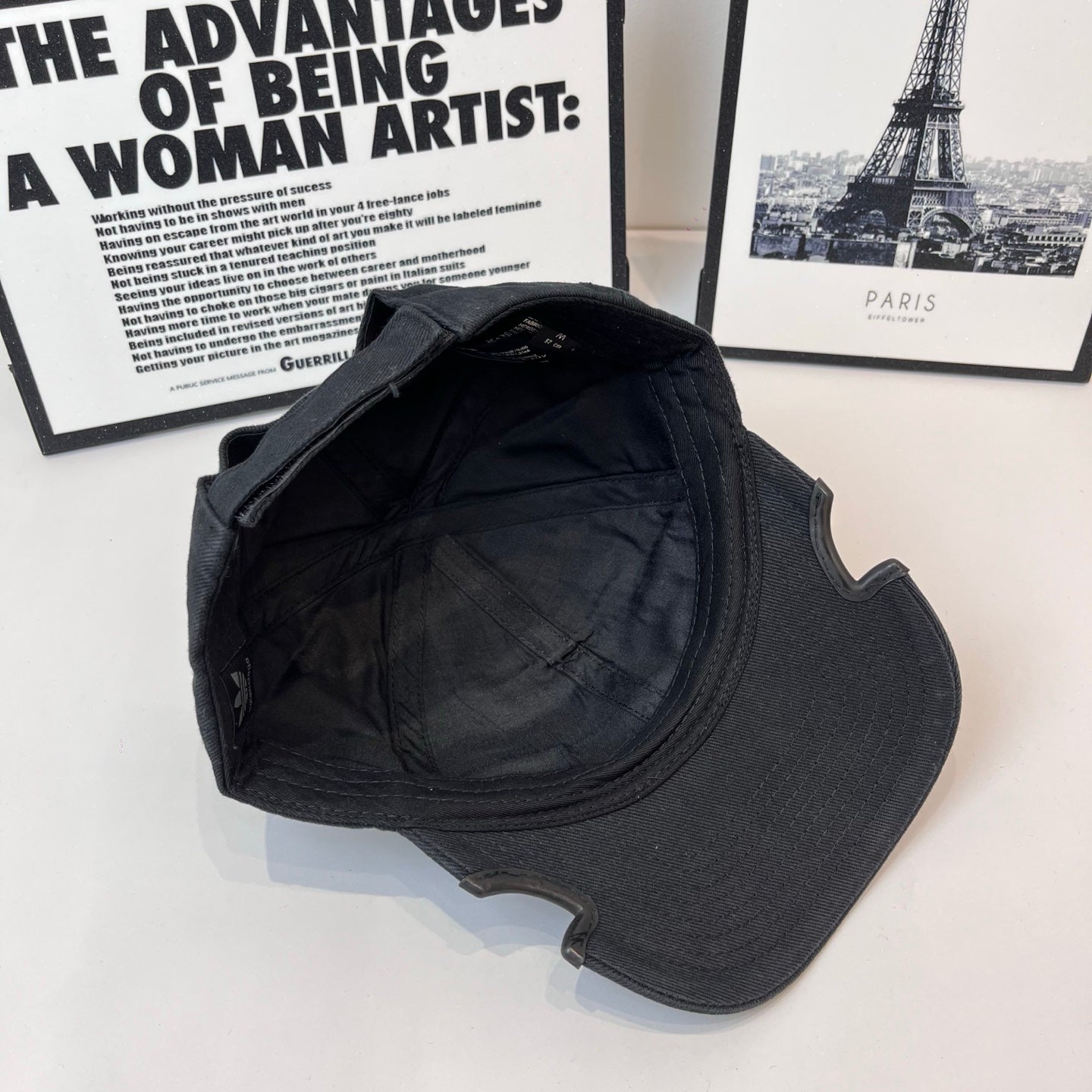 Black baseball cap interior back view with curved brim seam stitching