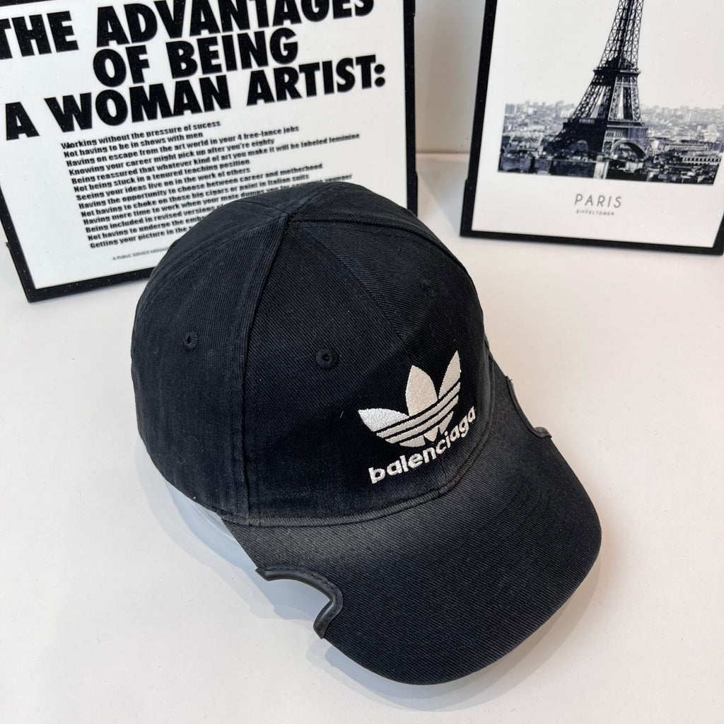 Balenciaga baseball cap, 3/4 angle, dark fabric with white trefoil and logo
