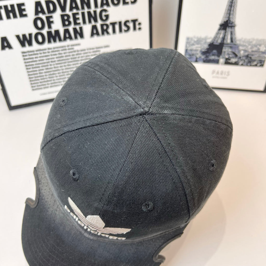 Black baseball cap back view with ventilation eyelets and small logo