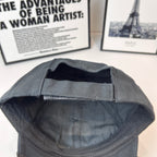 Baseball cap interior view, dark quilted lining with stitched brim seam