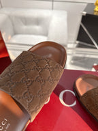 Gucci slide sandal strap with GG monogram pattern, dark brown.