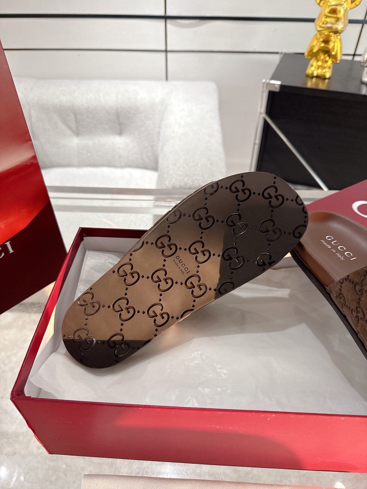 Gucci monogram slide sandal, dark brown, GG-pattern wide strap and open toe.