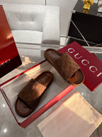 Gucci monogram slide sandals, dark brown, open toe with wide padded strap.