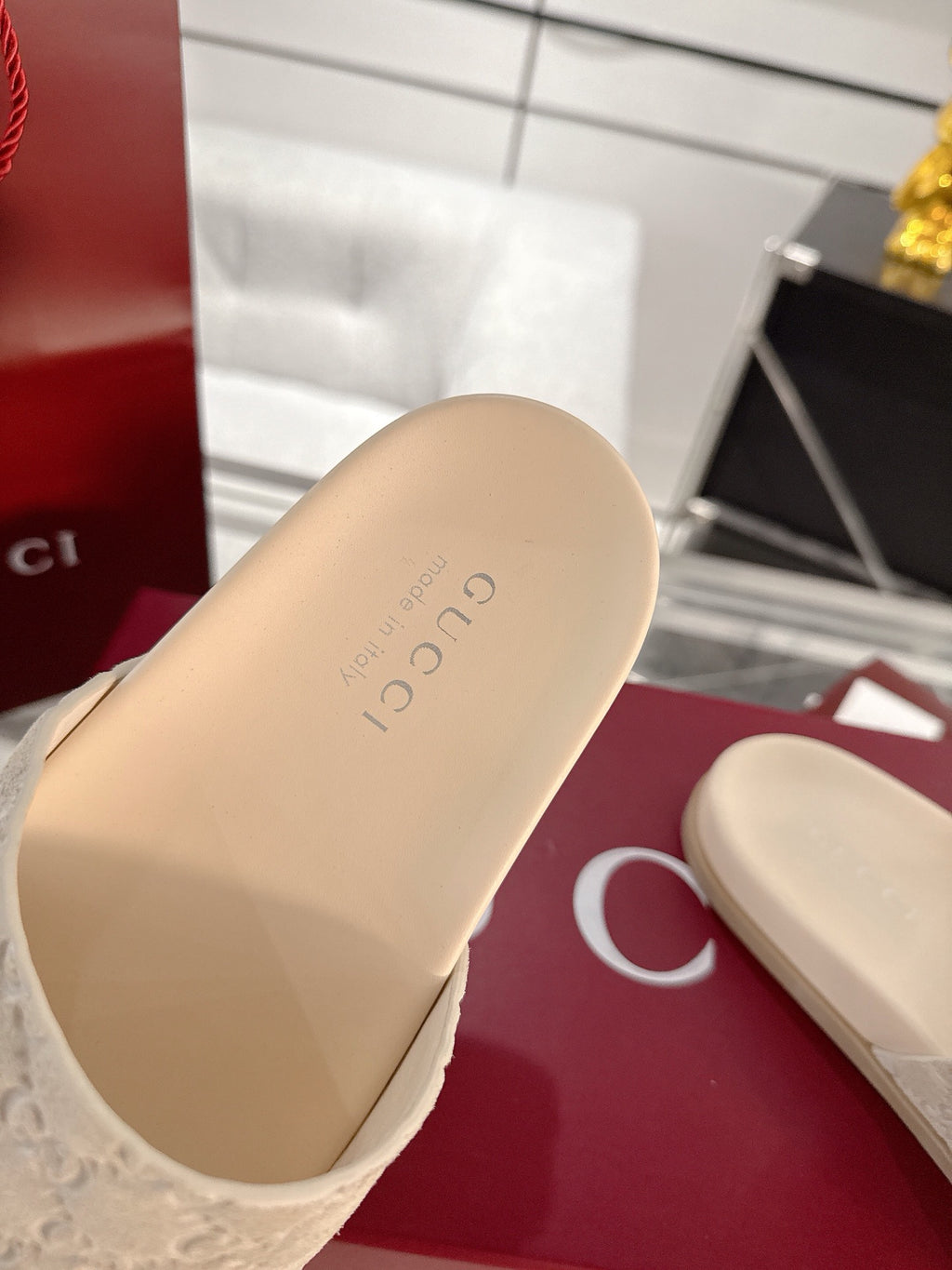 Gucci slide sandals, light beige footbed with embossed logo