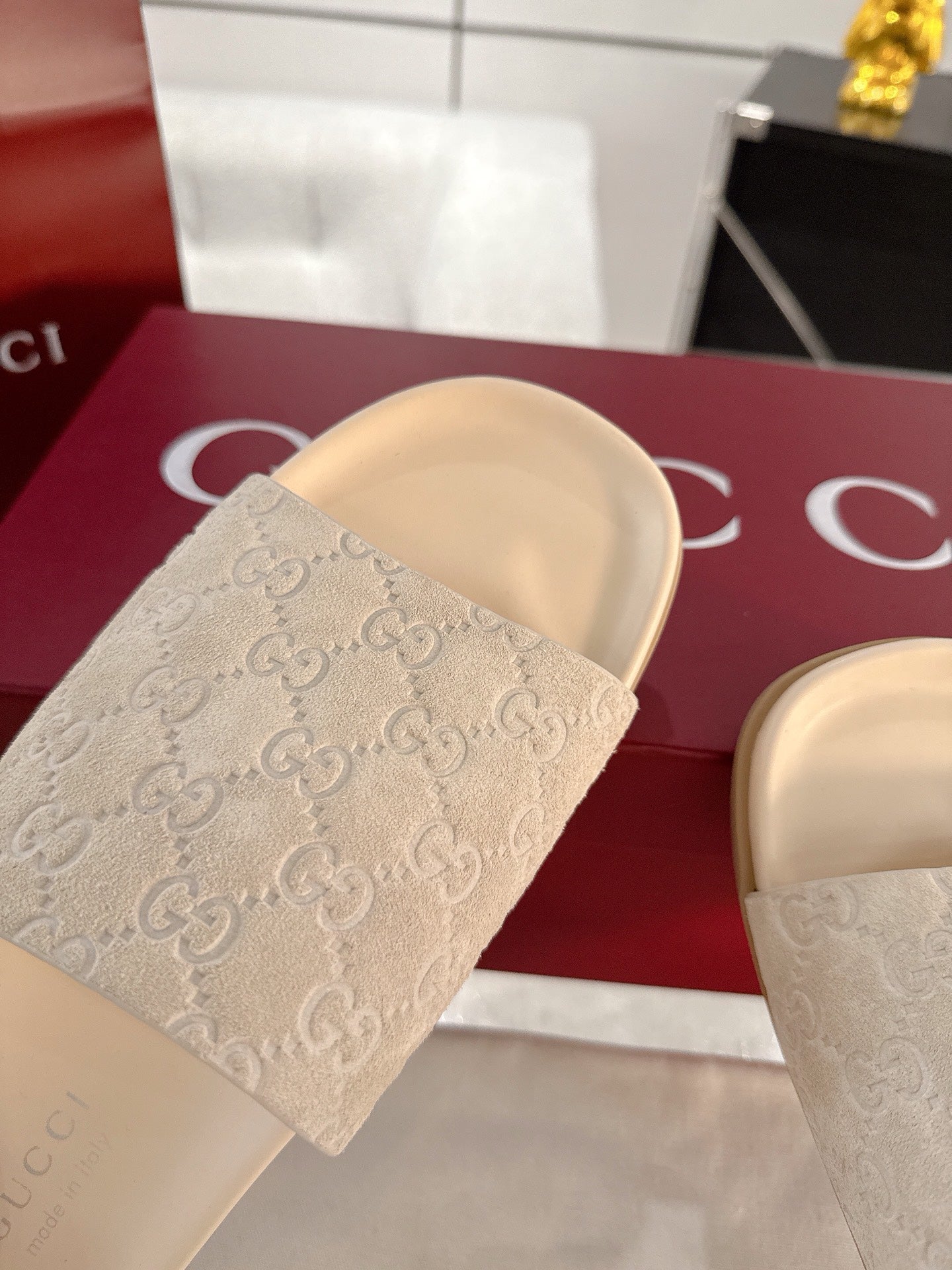 Gucci monogram slide sandals, light beige textured strap with cushioned base