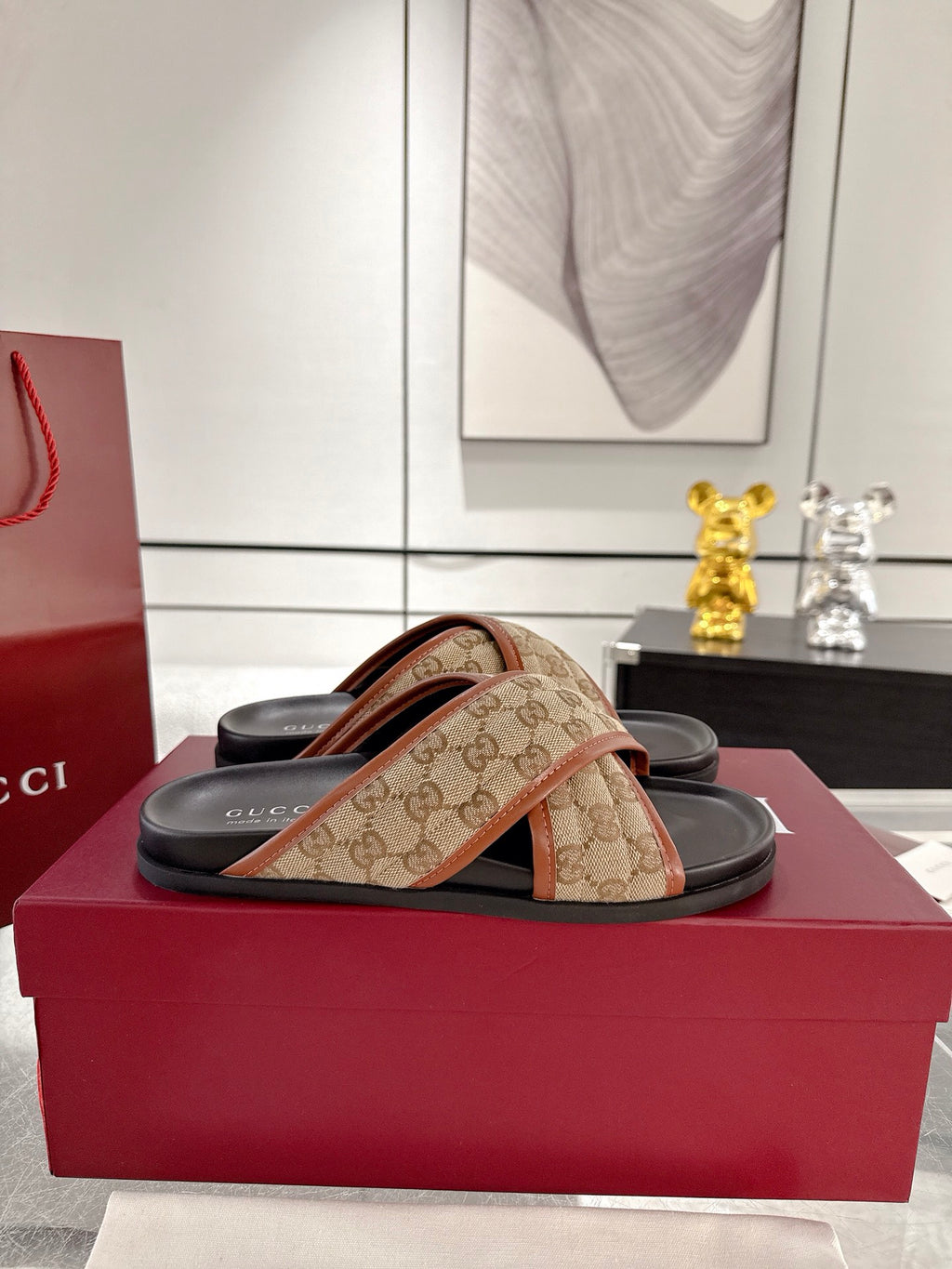 Gucci slide sandals on box, beige GG canvas crossover straps and black sole