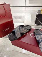 Gucci slide sandals, blue GG canvas strap with black sole and footbed