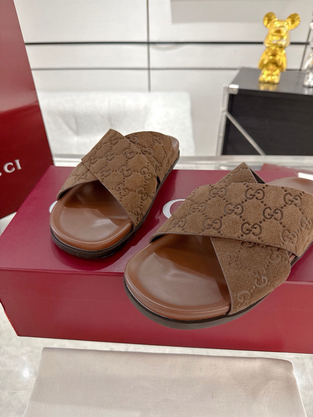 Gucci GG slide sandals, dark brown with open toe and crossover strap