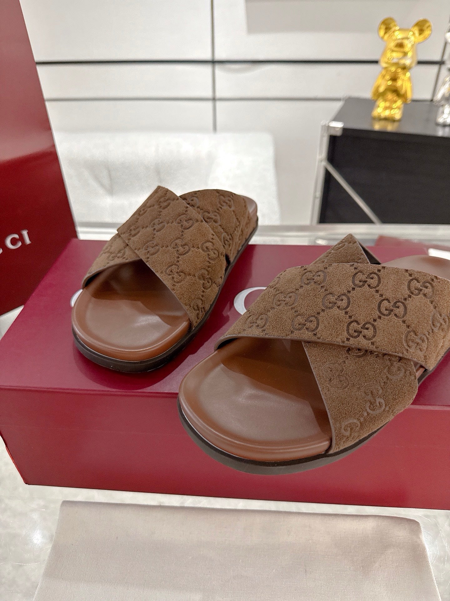 Gucci GG slide sandals, dark brown with open toe and crossover strap