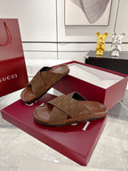 Gucci dark brown GG slide sandals with crossover strap, pair on red box