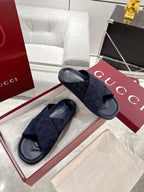 Gucci dark blue slide sandals, crisscross GG-pattern straps on cushioned footbed