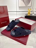 Gucci slide sandals with dark blue GG-pattern upper and thick rubber slide sole