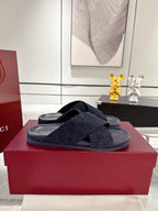 Gucci dark blue slide sandals with crisscross GG-pattern strap and wide footbed