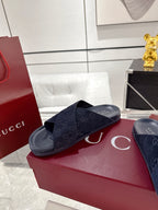 Gucci slide sandals in dark blue with GG logo fabric upper and molded rubber sole