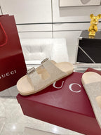 Gucci monogram slide sandals with two silver buckles on beige straps