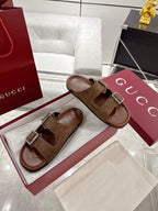 Brown logo-print slide sandals with two silver-tone buckle straps, open toe design