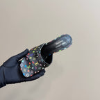 Louis Vuitton heeled mule on hand, top view of black multicolor monogram upper and open collar