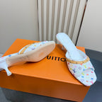 Louis Vuitton ladies heeled mules with sole shown, white multicolor monogram print, gold trim