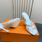 Light blue mule heel with patterned upper and white footbed, gold strap detail