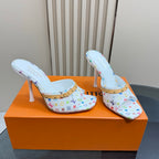 Light blue patterned mule heels with gold strap, open heel, white stiletto heel