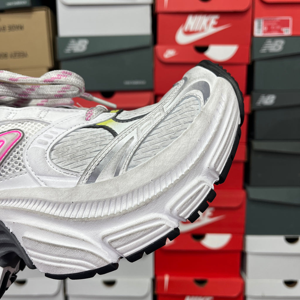 Unisex sneaker side closeup with white mesh panels and chunky ribbed sole.