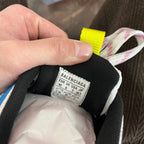 Unisex sneaker interior size label with BALENCIAGA text and fabric lining.