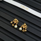 Dior gold-tone star and pearl earrings with logo charm and stones