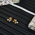 Dior gold-tone star and pearl earrings with rhinestone logo accents