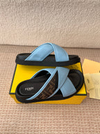 Light blue slide sandals with double straps and black ridged sole
