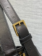 Black Dior leather strap with gold buckle and attachment hardware