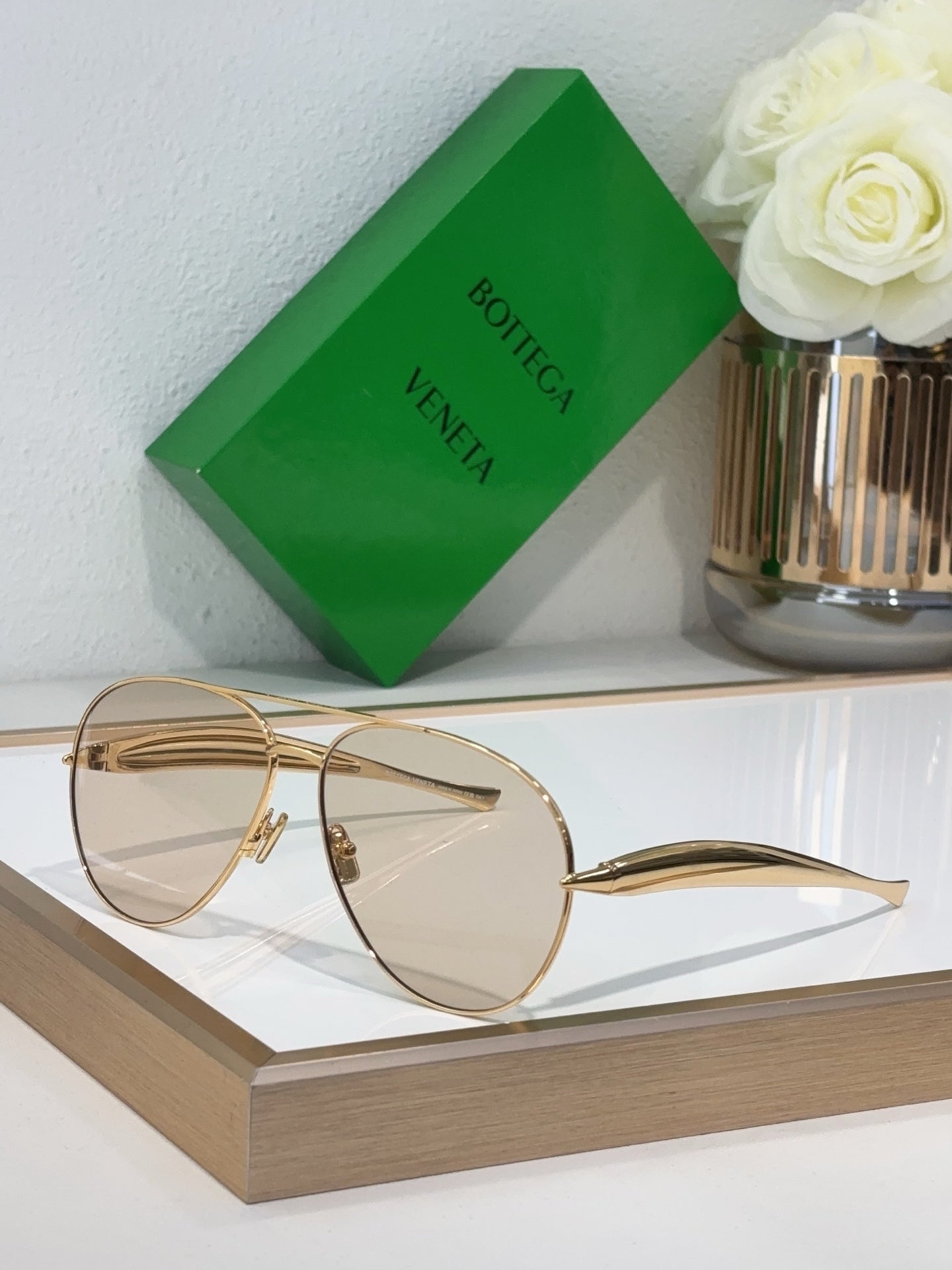 Bottega Veneta sunglasses with gold metal frame and clear lenses