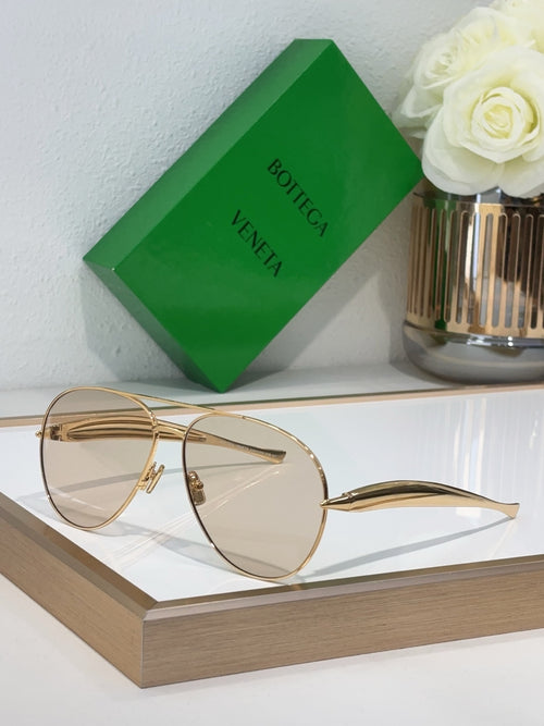 Bottega Veneta sunglasses with gold metal frame and clear lenses