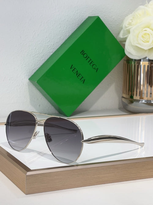 Bottega Veneta sunglasses with gold metal frame and dark gray lenses