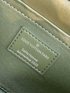 Louis Vuitton interior leather label with 'Louis Vuitton' text and model details