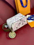Louis Vuitton crossbody bag in multicolor check with green strap and gold monogram charm