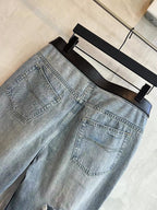 Light blue denim pants with patch pocket detail and stitched seams