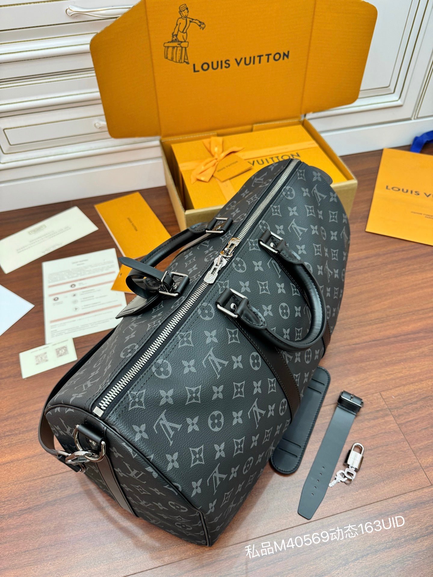 Louis Vuitton monogram duffle bag, dark gray with hardware and crossbody strap