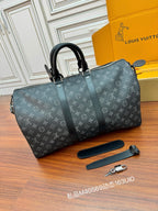 Louis Vuitton monogram duffle bag in dark gray, with strap and matching belt-like strap
