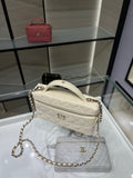 Quilted white Chanel shoulder bag with chain strap and top zipper
