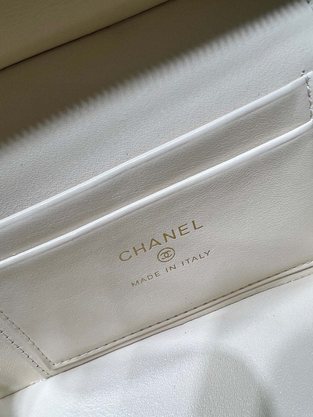 CHANEL 'MADE IN ITALY' label on cream leather bag