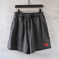 Dark gray denim shorts with elastic waistband and side pockets